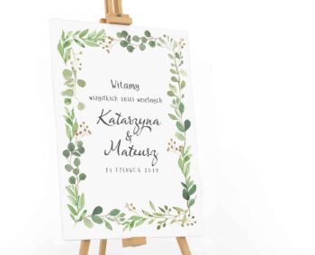 Tablica powitalna dla gości weselnych z zielonymi listkami w stylu watercolor