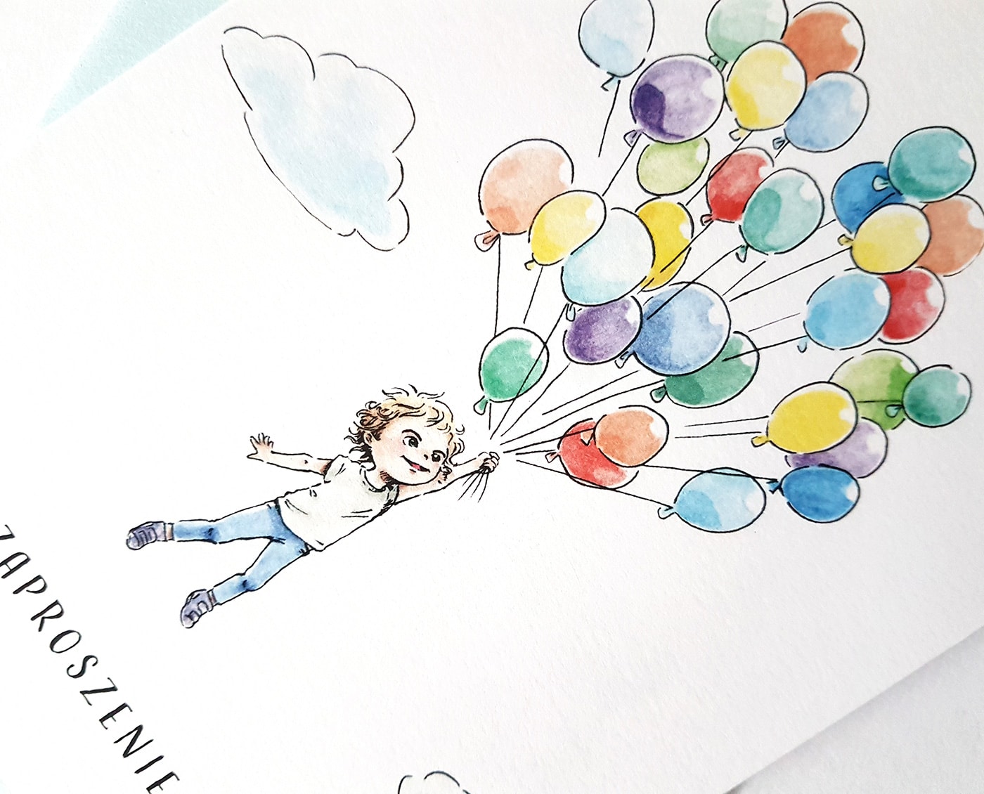 Rysunek chłopca trzymającego kolorowe baloniki